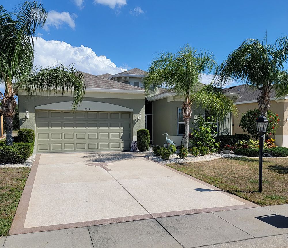 A house with a large driveway and a garage